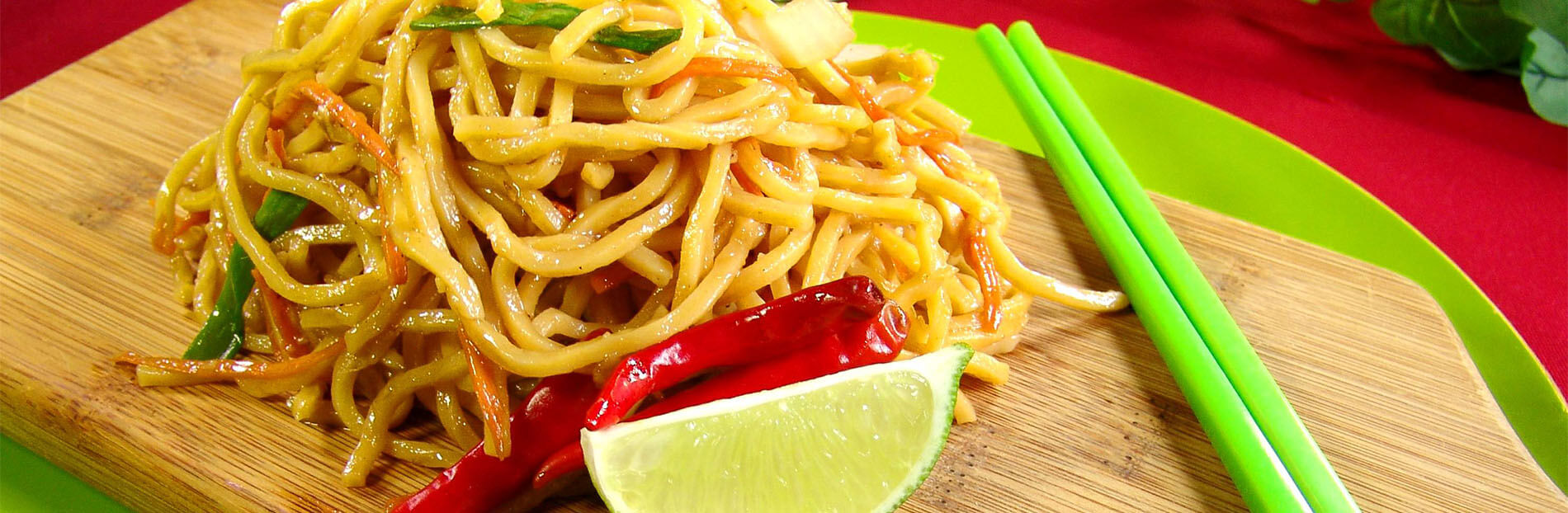 Noodles with chili and lime on a cutting board